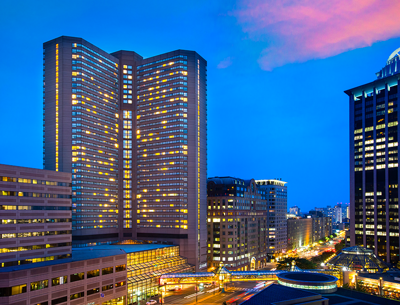 Boston cityscape, featuring the Boston Marriott Copley Place hotel, at night