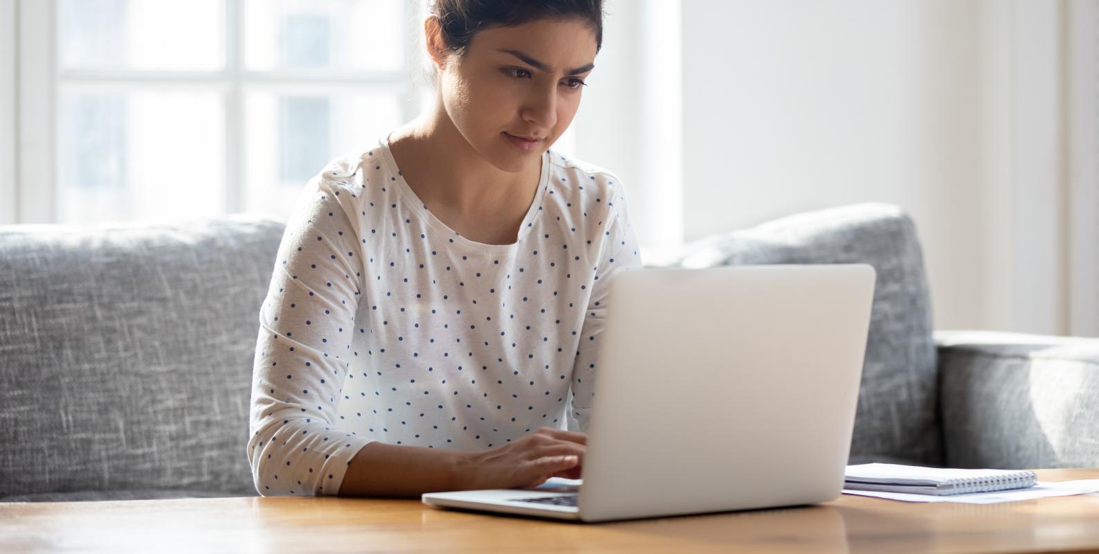 Person taking the LSAT at home on a laptop