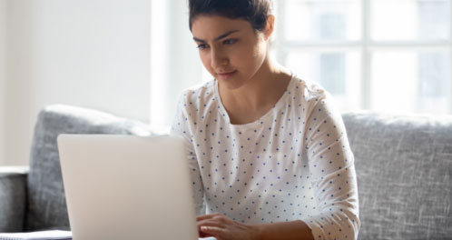 Student studying at laptop