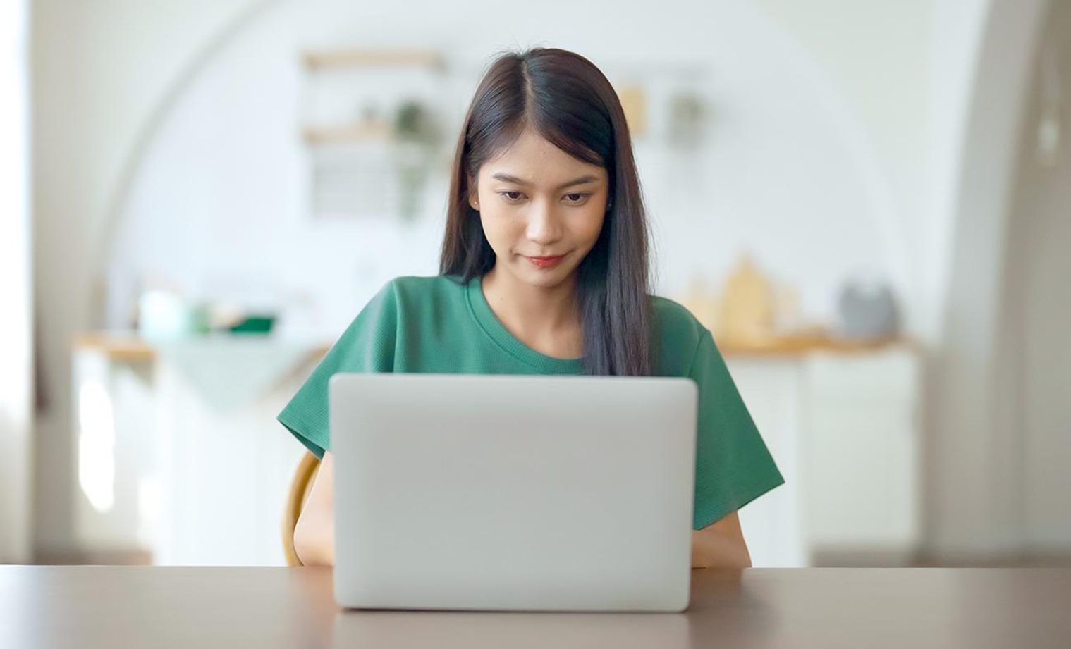 Person using laptop to take remote LSAT