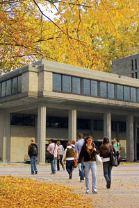 Students walking to and from the university in autumn