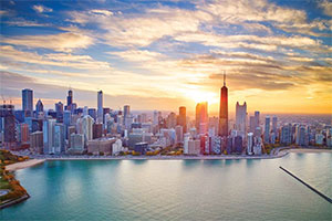 View of Chicago skyscrapers from Lake Michigan at sunset.