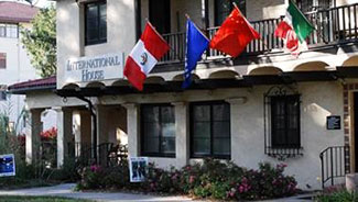 Colorful flags hang from the awning over International House.