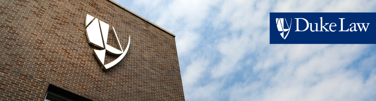 Duke Law School brick tower with shield logo