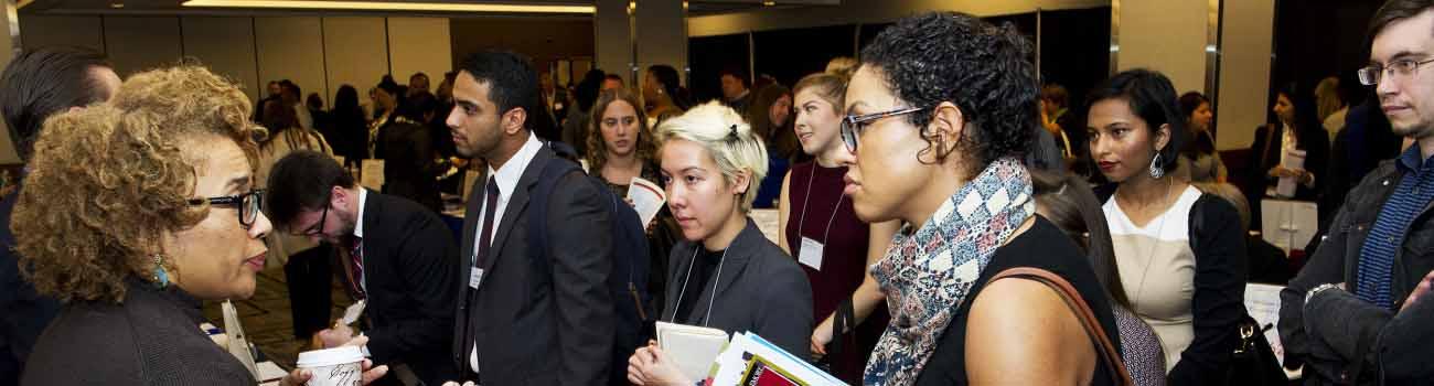 Meeting with law school representatives at an LSAC Law School Forum