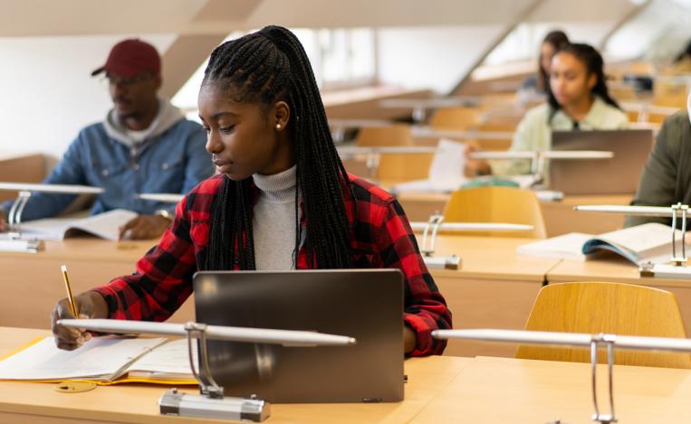 Students at laptops at test center