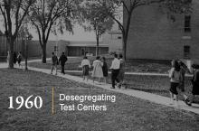 Integrated students walk along a path toward a test center.