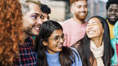 Group of diverse students gathered and smiling