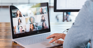 Connecting with colleagues virtually on a laptop