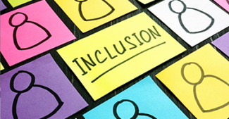 Collage of colorful post-it notes. The one in the center says, "INCLUSION."