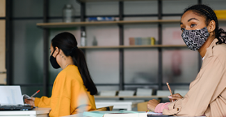 In-person students wear masks in the classroom