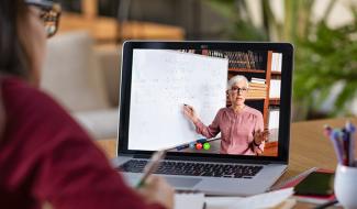 person viewing class on laptop