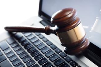 judge's gavel resting on a laptop