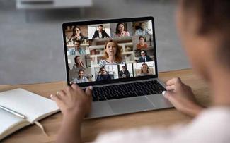 attending the webinar on a laptop
