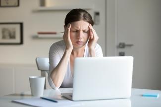 Person concentrating at a laptop