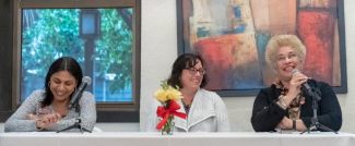 Dean Lisa Kloppenberg, law professor Thiadora Pina, and LSAC Deputy for Legal and Global Higher Education Camille deJorna speaking on panel