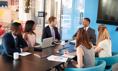People gathered around conference table