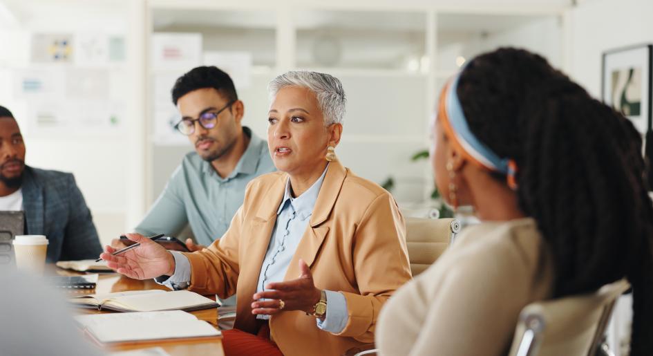 a group of professionals speak together