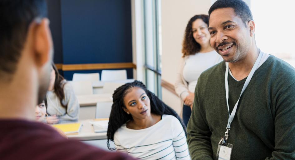 Instructor speaking with students