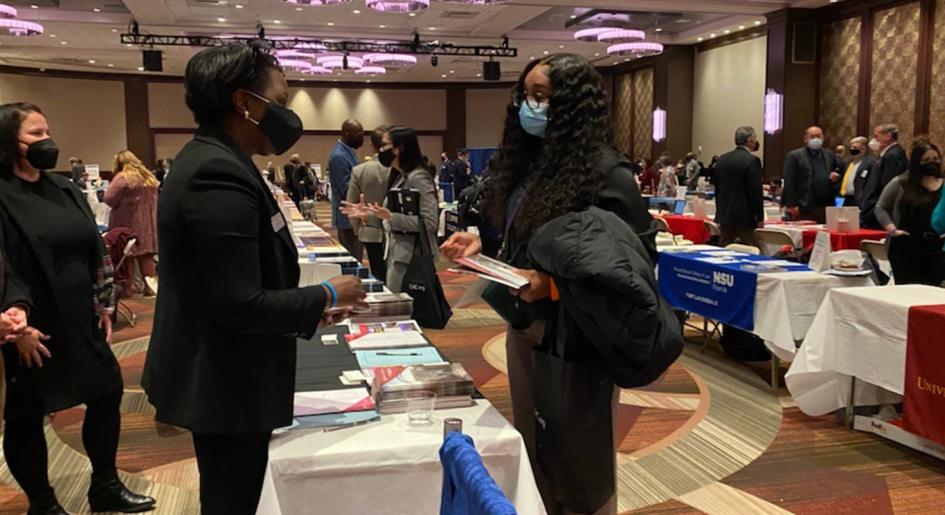 Forum attendee speaks with representative.