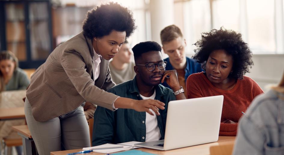 Law students gathered around laptop