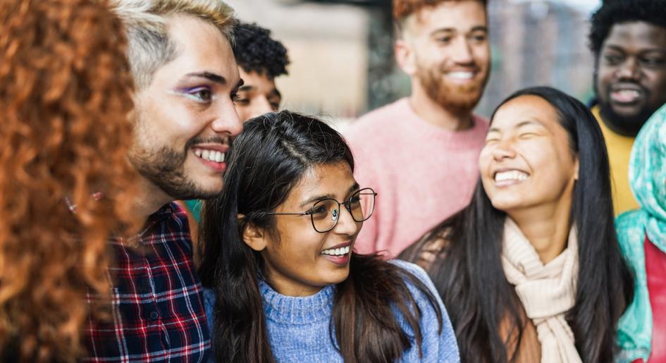 Group of diverse students gathered together smiling