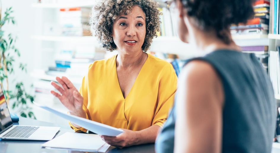A prelaw advisor speaks with a student
