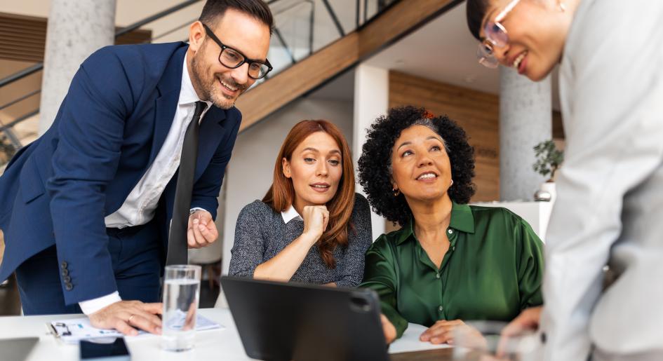 A group of professionals sit around a table