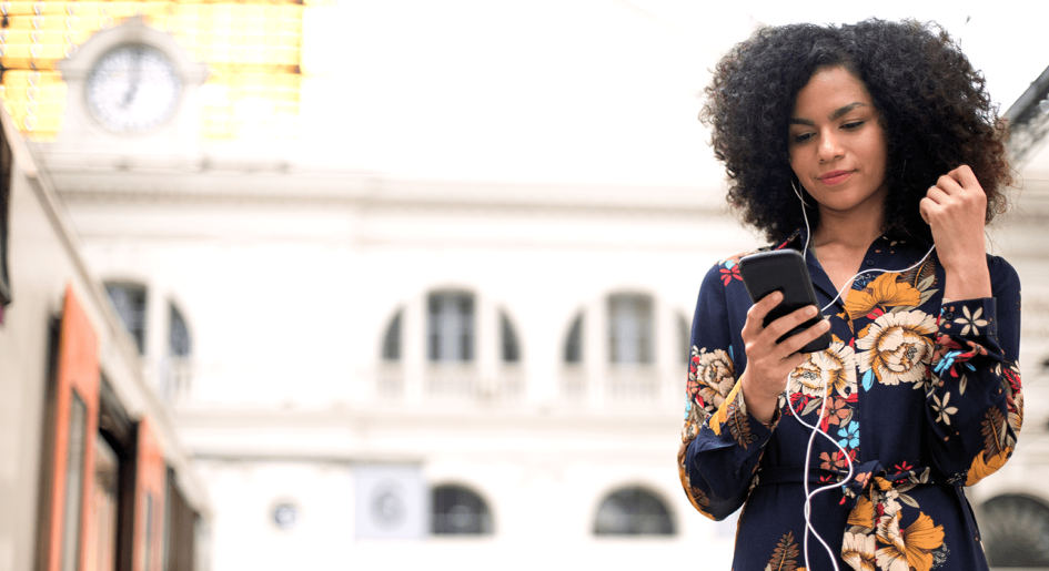 woman listening to podcast on her mobile phone