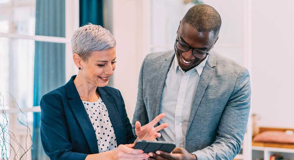 Law professionals reviewing information on a tablet