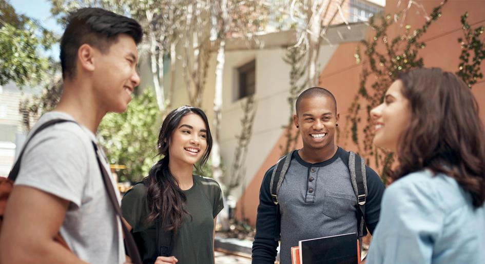 Diverse international students conversing outside