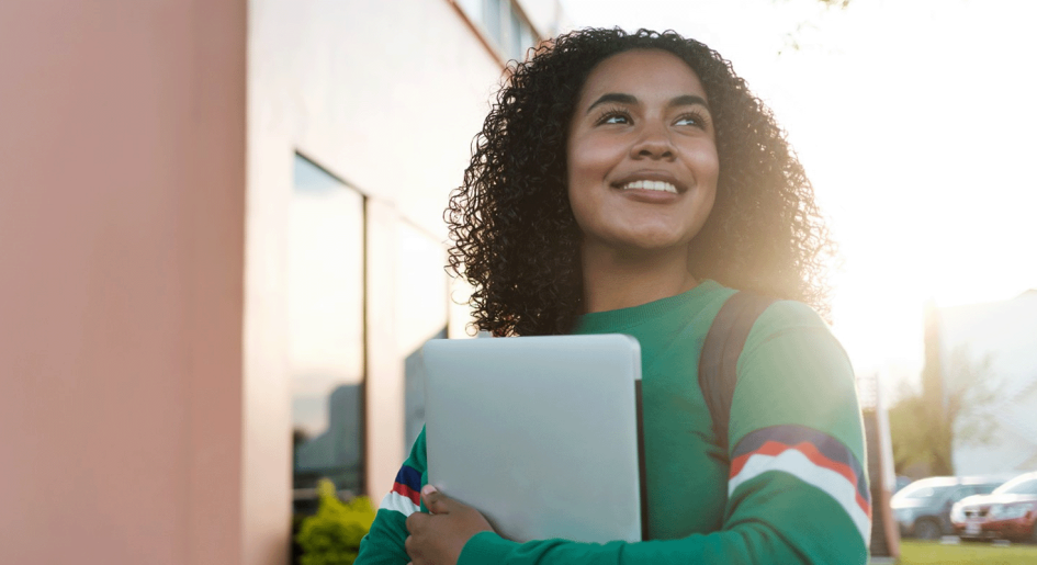 university student smiling in the sunlight