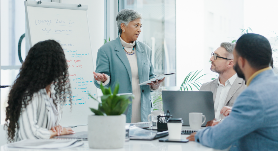 diverse law professionals conversing around conference table