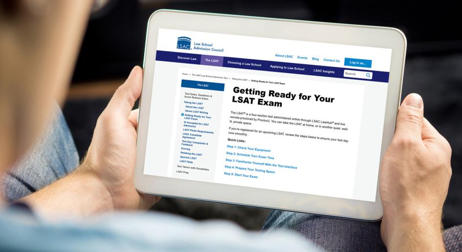 Person looking at "Getting Ready for Your LSAT Exam" page on tablet.