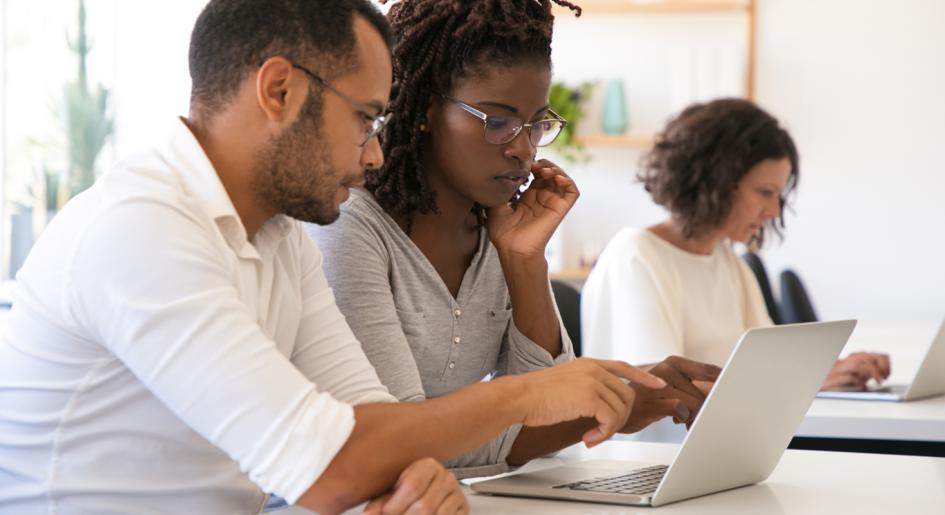 Law students studying on laptop