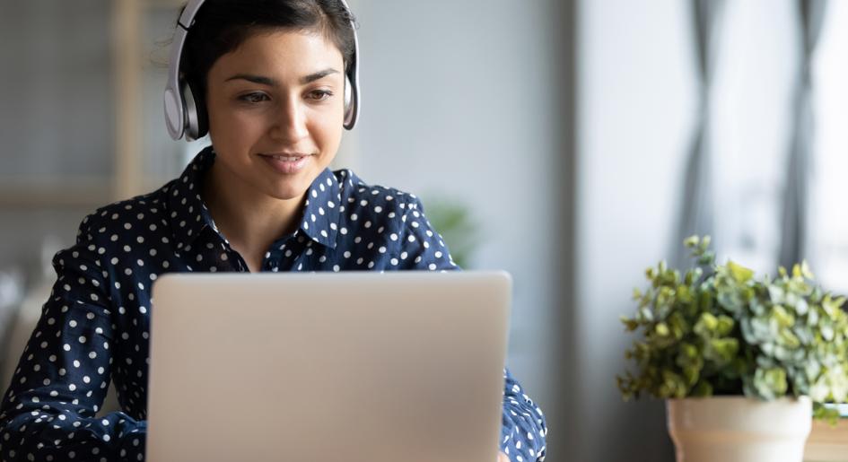 Person on laptop with headphones on