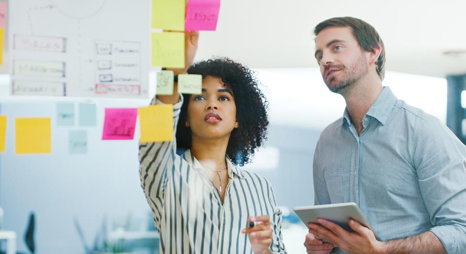 Legal professionals looking at post-it notes