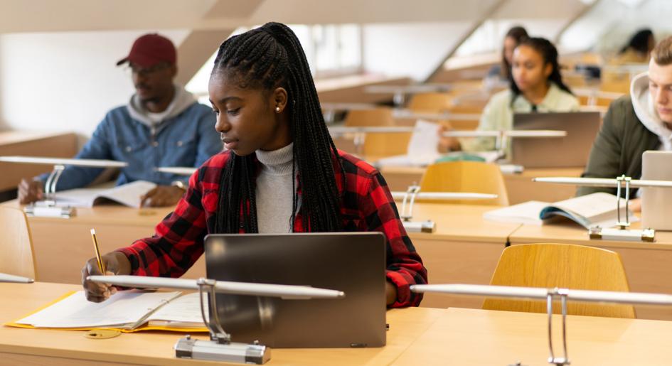 Students with laptops at a test center