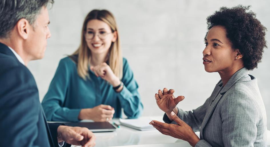 Three legal professionals conversing