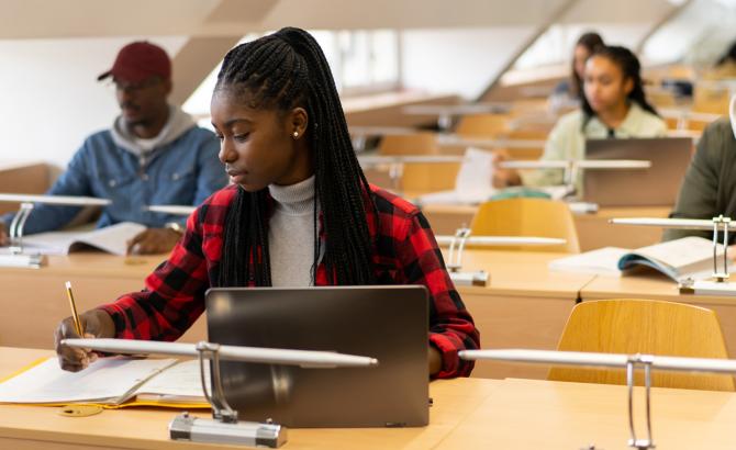 Students with laptops at a test center