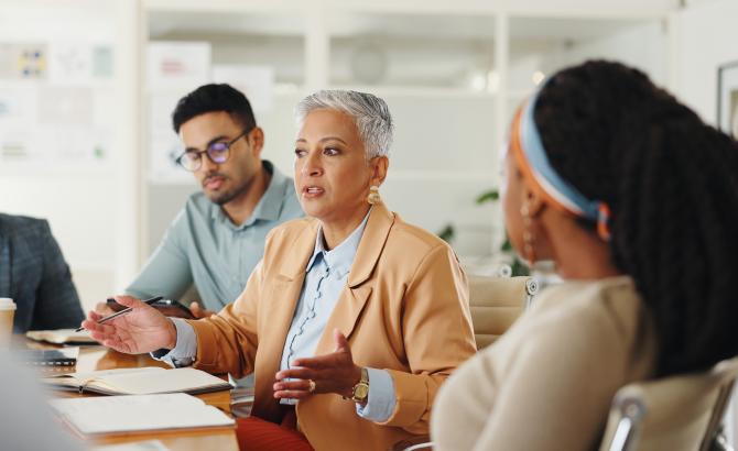 a group of professionals speak together
