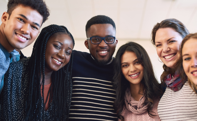 Group of diverse law students smiling.