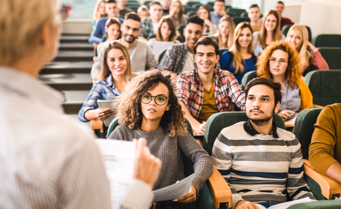 A teacher addresses a class