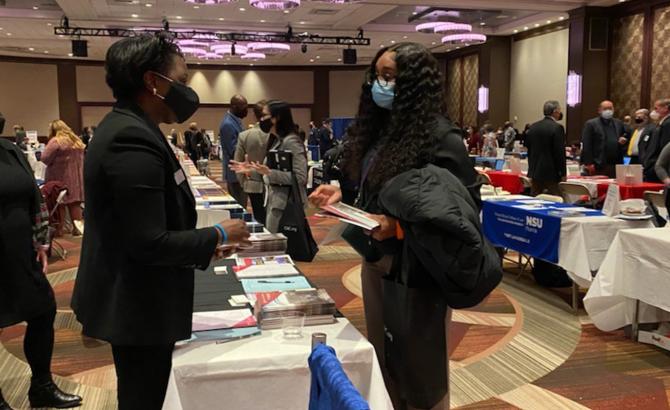 Forum attendee speaks with representative.