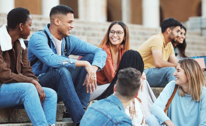 diverse law students gathered on steps socializing