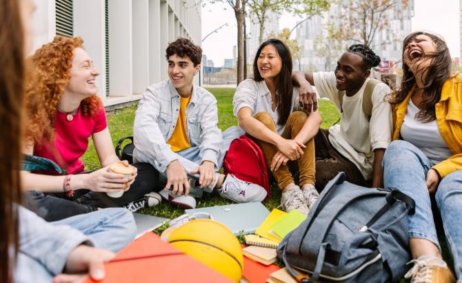 a group of law students sits together, smiling