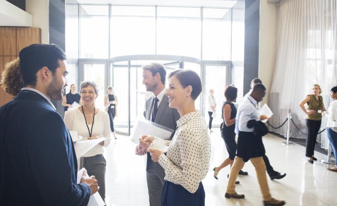 Law students talking in atrium.