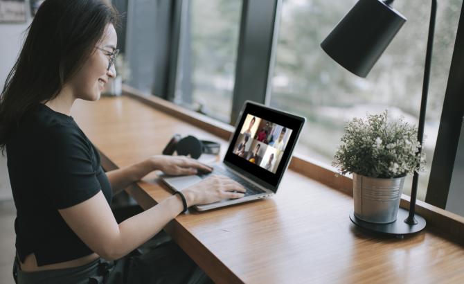 connecting with other students virtually on a laptop