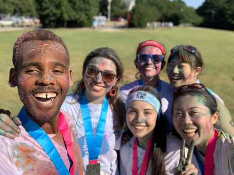 Duke students smiling after friendly competition.